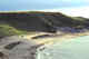 The capes (cliffs) and sandy beach. Bering Island. Commanders.