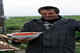 Aleut fisherman Ivan Voshikov with bowl of salmon caviar. Bering Island, 1995.