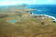 Aerial view of St George village with famous bird cliffs in the background. St George Island. Pribilofs. 